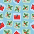 Holly berries and Christmas gifts. Seamless pattern. Royalty Free Stock Photo