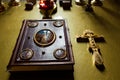 Holly bible book on table in church cross Royalty Free Stock Photo