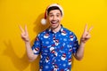 Holly jolly merry xmas party celebrate two hands v sign red hat pom pom blue shirt traditional picture isolated on Royalty Free Stock Photo