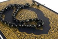 HOLLY QURAN COVER WITH ROSARY Royalty Free Stock Photo