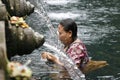 Holly springs in Balinese Tirta Empul Temple Royalty Free Stock Photo