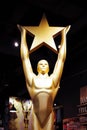 Hollywood, CA/ USA - July 26, 2018: Gold Oscar statue holding gold star