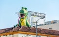 HOLLYWOOD, CALIFORNIA, USA - FEBRUARY 6, 2018: Dinosaur sculpture on the roof of the building on Hollywood boulevard of Walk of