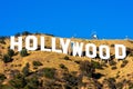 Hollywood sign white letters under blue sky on Mount Lee. The Hollywood Sign is an American landmark and cultural icon overlooking