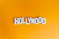 Hollywood wooden words in a orange background Royalty Free Stock Photo