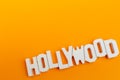 Hollywood wooden words in a orange background Royalty Free Stock Photo