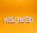 Hollywood wooden words in a orange background Royalty Free Stock Photo