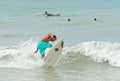 Surfers on the Beach Catching a Wave