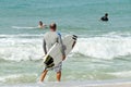 Group of Surfers on the Beach