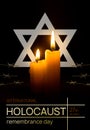 Holocaust Remembrance Day. Yom HaShoah. Bright Burning Candle and the star of David on a dark background. Memorial Day