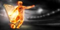 A hologram of a football player running out of a smartphone screen. The concept of sports betting, football, gambling, online Royalty Free Stock Photo