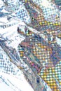 Holographic aluminium foil decor foil closeup pattern texture as background. Macro photo Royalty Free Stock Photo