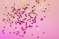 Holographic confetti stars on pink neon background