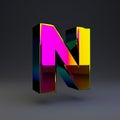 Holographic 3d letter N uppercase. Glossy font with multicolor reflections and shadow isolated on black background