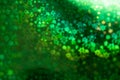 Holographic  green background with abstract colorful blur stars shaped bokeh Royalty Free Stock Photo