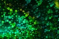 Holographic  green background with abstract colorful blur stars shaped bokeh Royalty Free Stock Photo