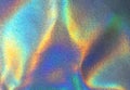 Holographic rainbow iridescent wrinkled background. Abstract and blurred backdrop