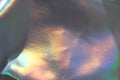 Holographic rainbow iridescent wrinkled background. Abstract and blurred backdrop