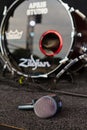 Holovanivsk, Ukraine - 09.27.2015: Shure Beta 52a microphone head lying on stage floor with Zildjian bass drum in background Royalty Free Stock Photo