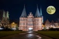 Holstentor Luebeck in Germany with Moon