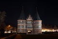 Holstentor in Luebeck at night, the medieval city gate is a popular tourist attraction of the historic old town in Royalty Free Stock Photo