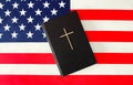 The Holy Bible and the American Flag Royalty Free Stock Photo