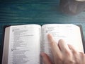 Holy Bible on a Blue Wooden Table Royalty Free Stock Photo