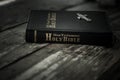 Holy Bible book on old rustic boards