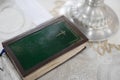 Holy Bible book is on the table covering by white tablecloth in Orthodox church Royalty Free Stock Photo