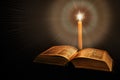 Holy Bible with candle Royalty Free Stock Photo