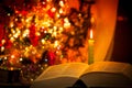 Holy Bible with candle on bokeh Royalty Free Stock Photo