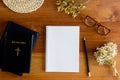 Holy Bible with coffee and natural flowers over the wooden table Royalty Free Stock Photo