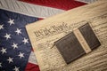 Holy bible on constitution and American Flag Royalty Free Stock Photo