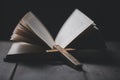 holy bible and cross or crucifix on old wooden background in church.Candlelight and open book on vintage wood table christianity Royalty Free Stock Photo