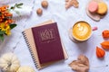 Holy Bible with cup of coffee and autumn cozy decor top view. Bible study fall concept Royalty Free Stock Photo