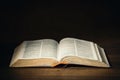 Holy Bible in the dark on a pastor desk