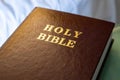 Holy Bible text on a leather cover book brown color, close up view Royalty Free Stock Photo