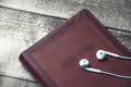 Holy Bible with headphones Royalty Free Stock Photo