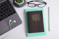 Holy Bible and laptop with headphones. Bible study, worship online concept Royalty Free Stock Photo