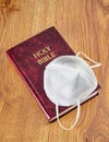 Holy Bible and N95 face Mask