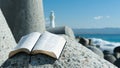 Holy Bible open to Psalm 119 on top of a breakwater. Beautiful blurred background with white lighthouse and sea with waves Royalty Free Stock Photo