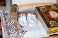 Holy Bible and Orthodox cross prepared for christening ceremony in church Royalty Free Stock Photo