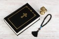 Holy Bible, rosary beads with cross and incense burner on white wooden background. Religion concept and faith Royalty Free Stock Photo