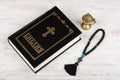 Holy Bible, rosary beads with cross and incense burner on white wooden background. Religion Royalty Free Stock Photo