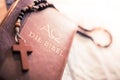 Holy bible and rosary: Christian bible and rosary on a wooden desk