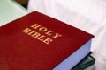 Holy Bible text on a leather cover book red color, close up view
