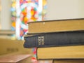 Holy bible on a wooden church bench