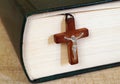 Holy Bible and a wooden cross with Jesus