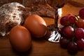 Holy Communion and Easter concept with The Holy Bible. Bread, eggs, grapes and a silver chalice of red wine Royalty Free Stock Photo