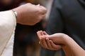 Holy communion. hands receiving the host